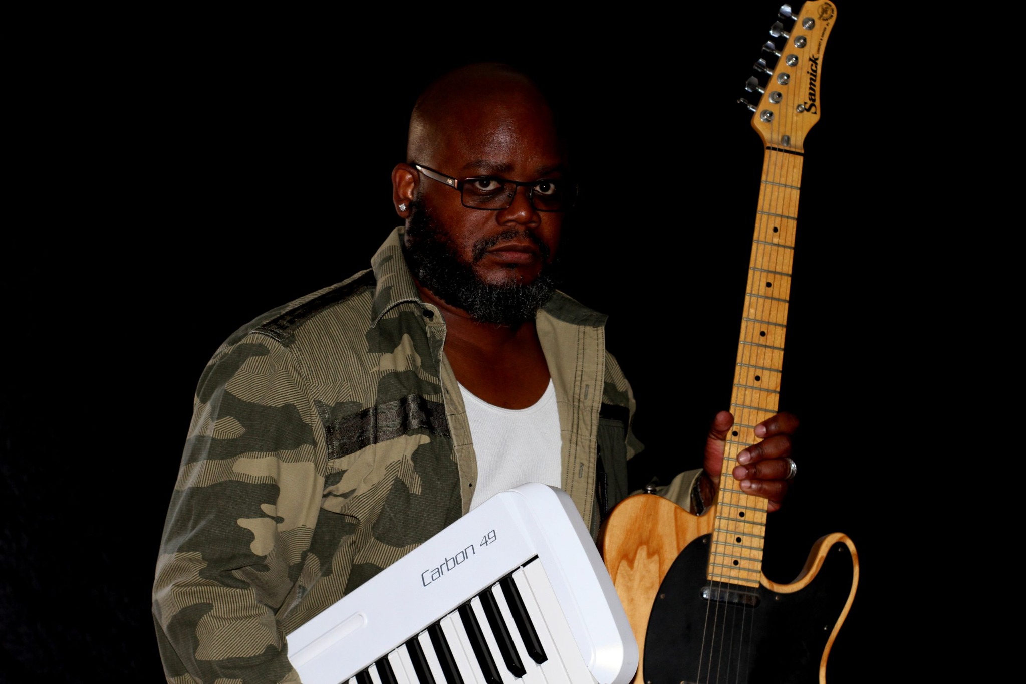 Dallas holding guitar and keyboard
